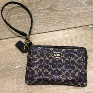 Purple Coach wristlet.